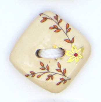 Пуговица маленькая керамическая (6-5,6; 13-9(14х14))